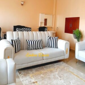 lux white sofa with gold detail